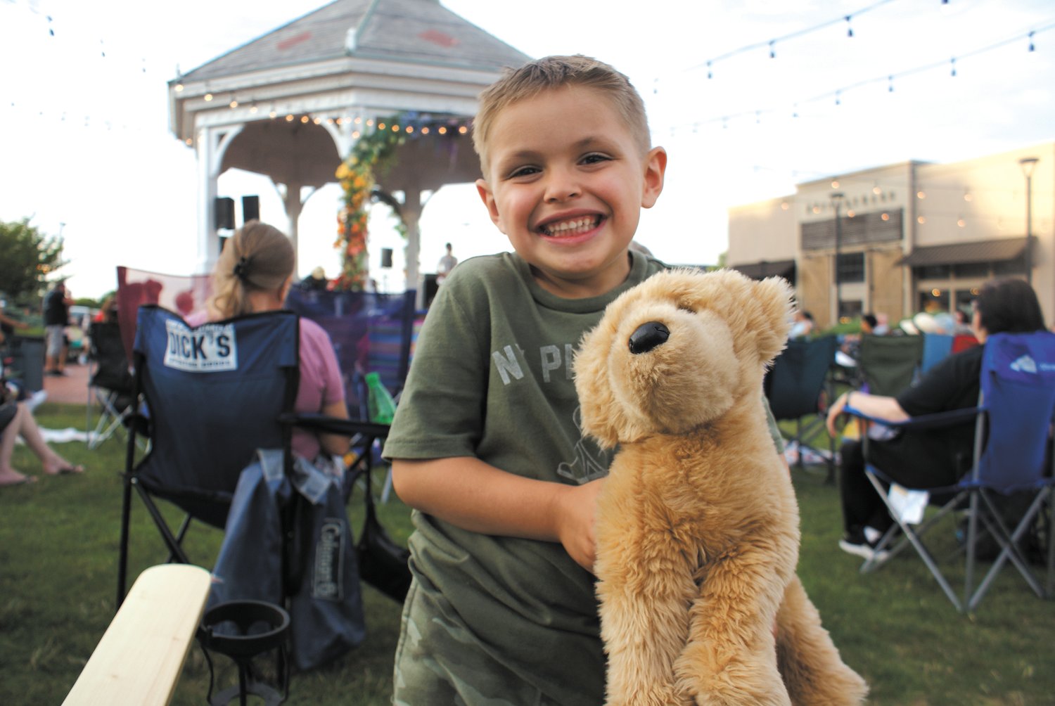 HERE WITH HIS FOUR-LEGGED PAL: Five-year-old Christian Marchetti loved the music. He came to the Garden City concert with his best friend Douglas whom he is holding.